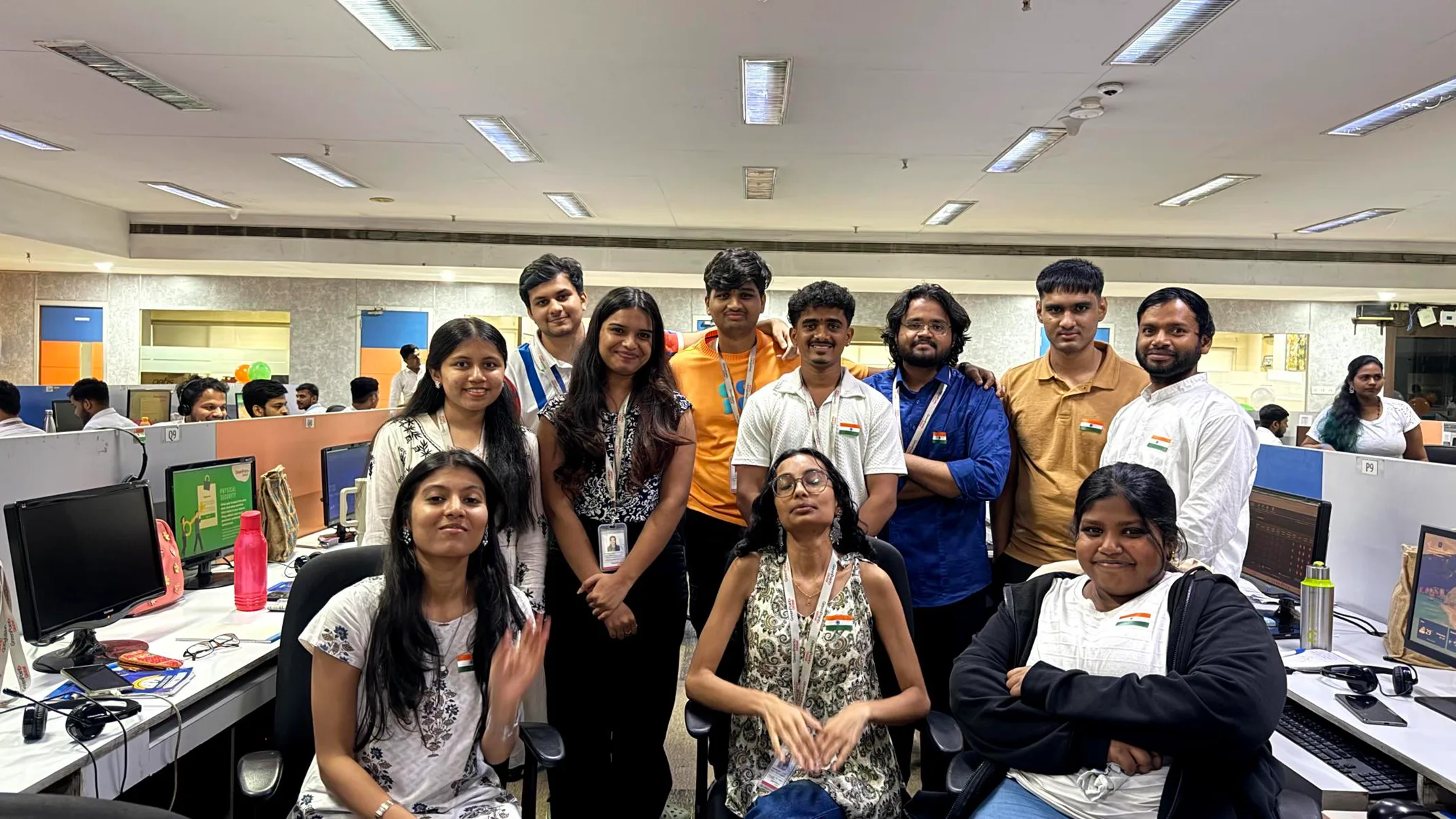 Colleagues posing together during an office celebration